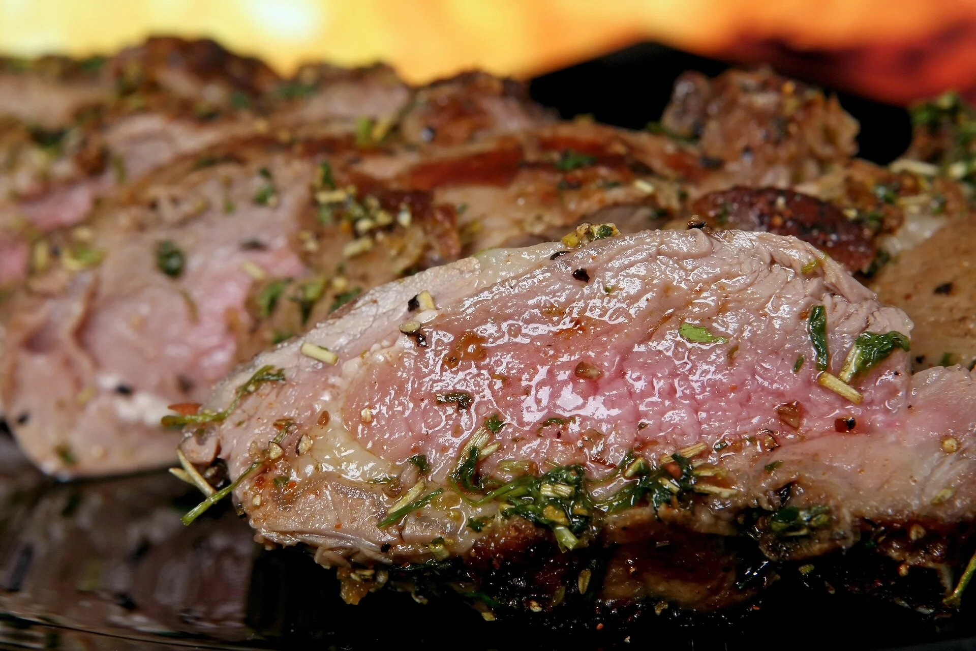 Herb-crusted lamb cooked pink and sliced